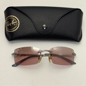 Ray-Ban RB3248 rimless sunglasses with pink tint lenses